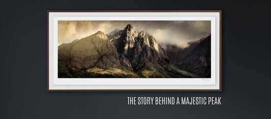 An ethereal panoramic landscape photograph of mountain peaks on display in a modern dining room interior 