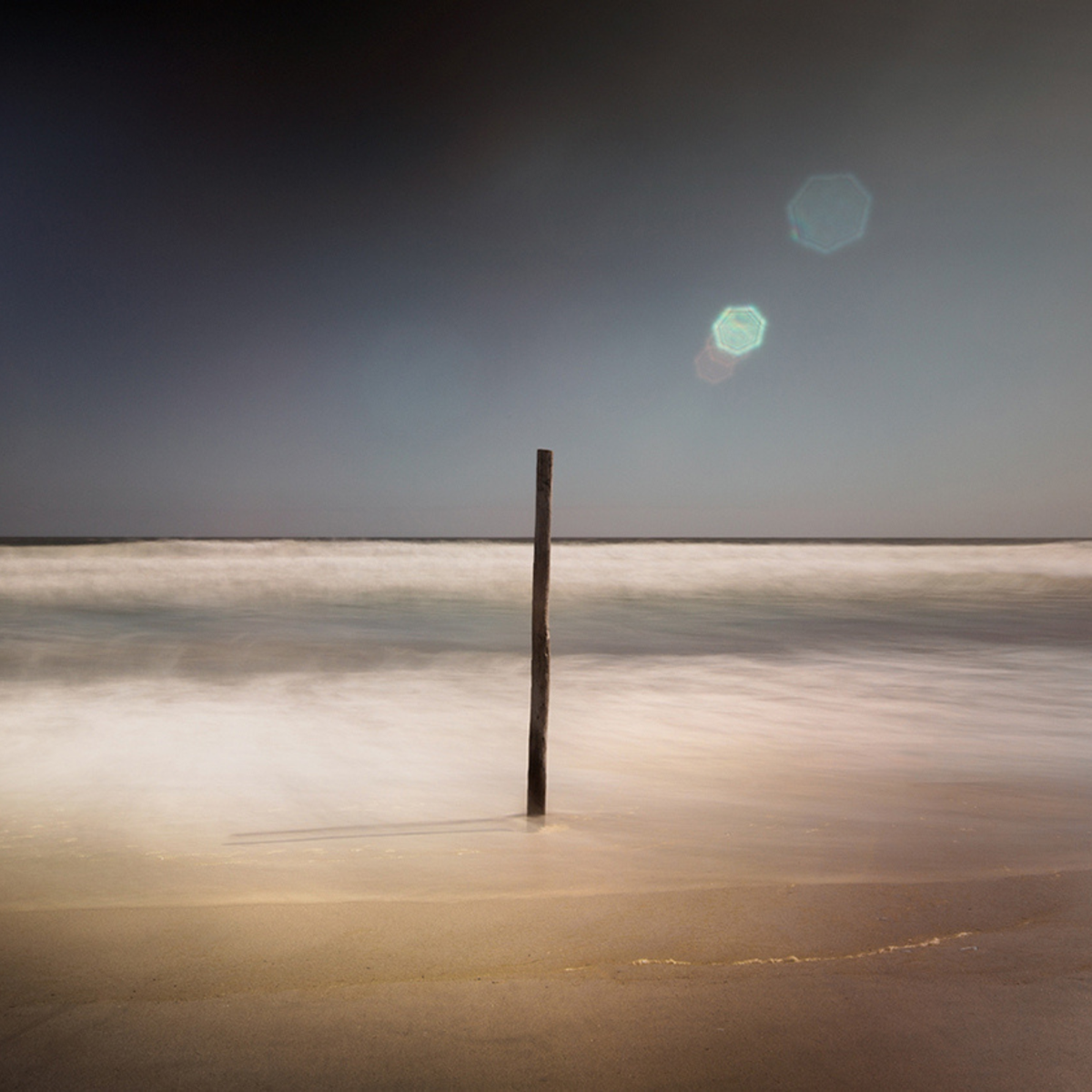 Atlantic Flare by Samantha Lee Osner, a wooden post in the Atlantic
