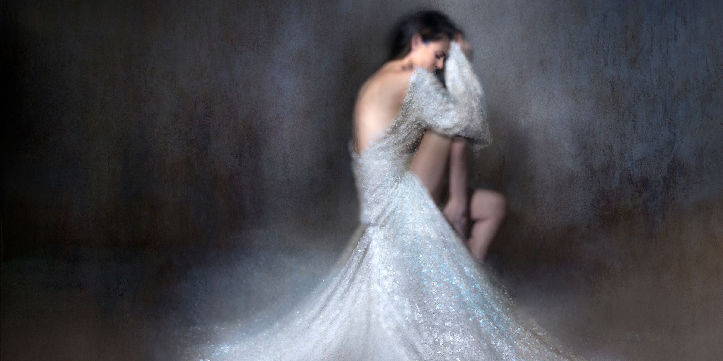Woman in a bridal dress posing for a studio photograph which forms part of Ramzi Mansours fine art photography collection