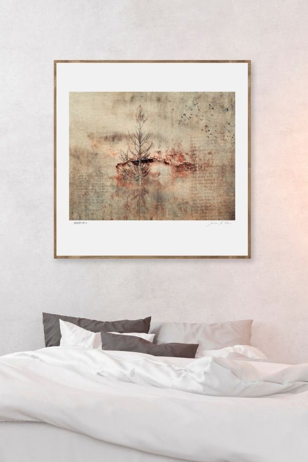 Framed artwork by Samantha Lee Osner called Memoirs of light above a bed in a bedroom setting